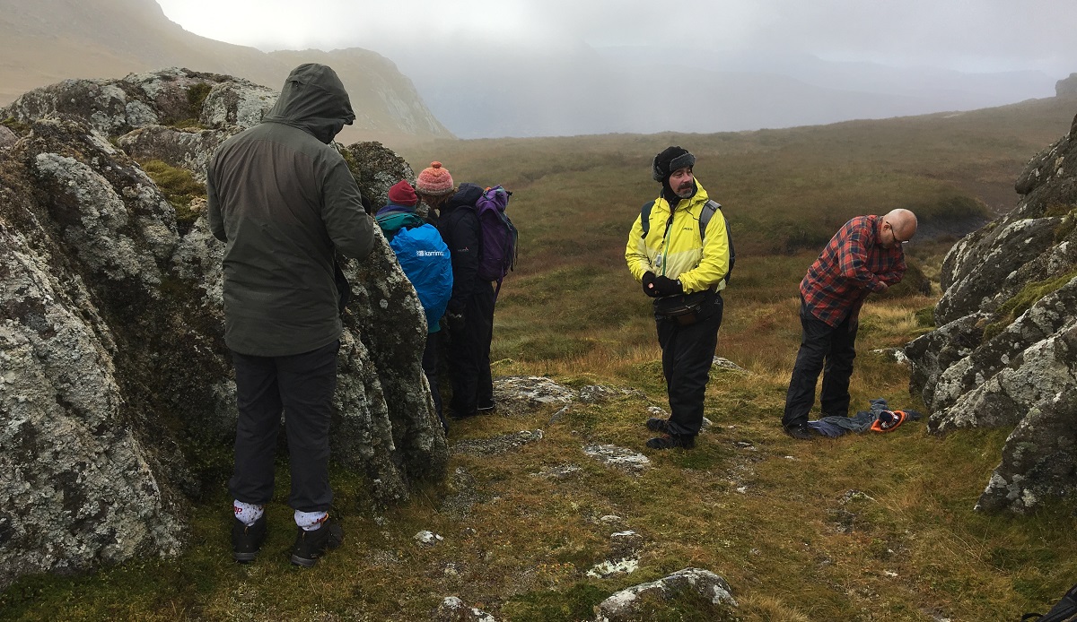 The expedition group studying rocky outcrops on Ben Loyal, Sutherland - LAFF 2019 (c) April Windle